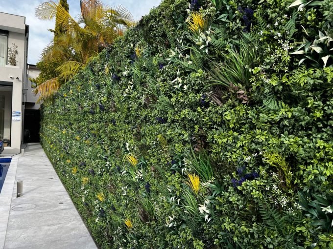 Premium Artificial Green Wall Panels Installed onto a fence