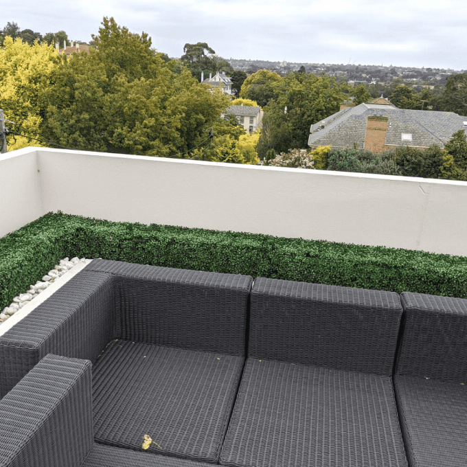 artificial green wall panels installed at terrace of home