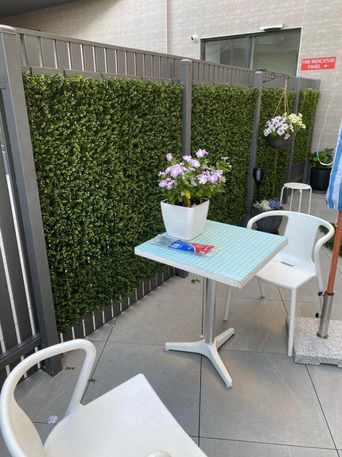 Relaxing Apartment Outdoor Area made possible with Premium Natural Buxus Hedge Panels