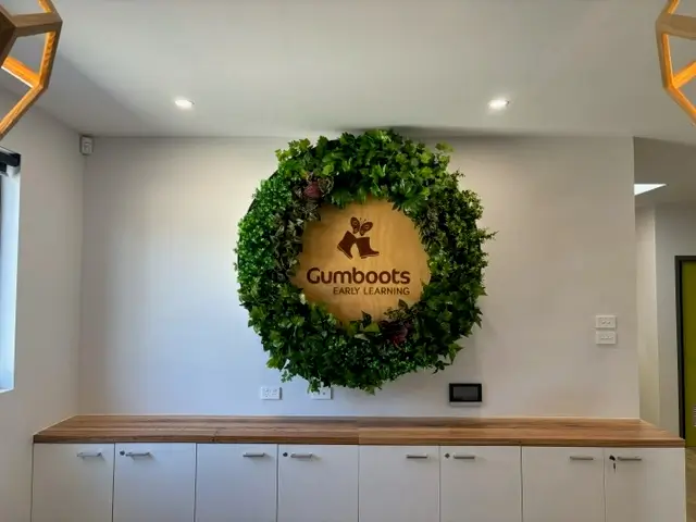 Vibrant and Stunning Company Logo on a Green Wall Disc