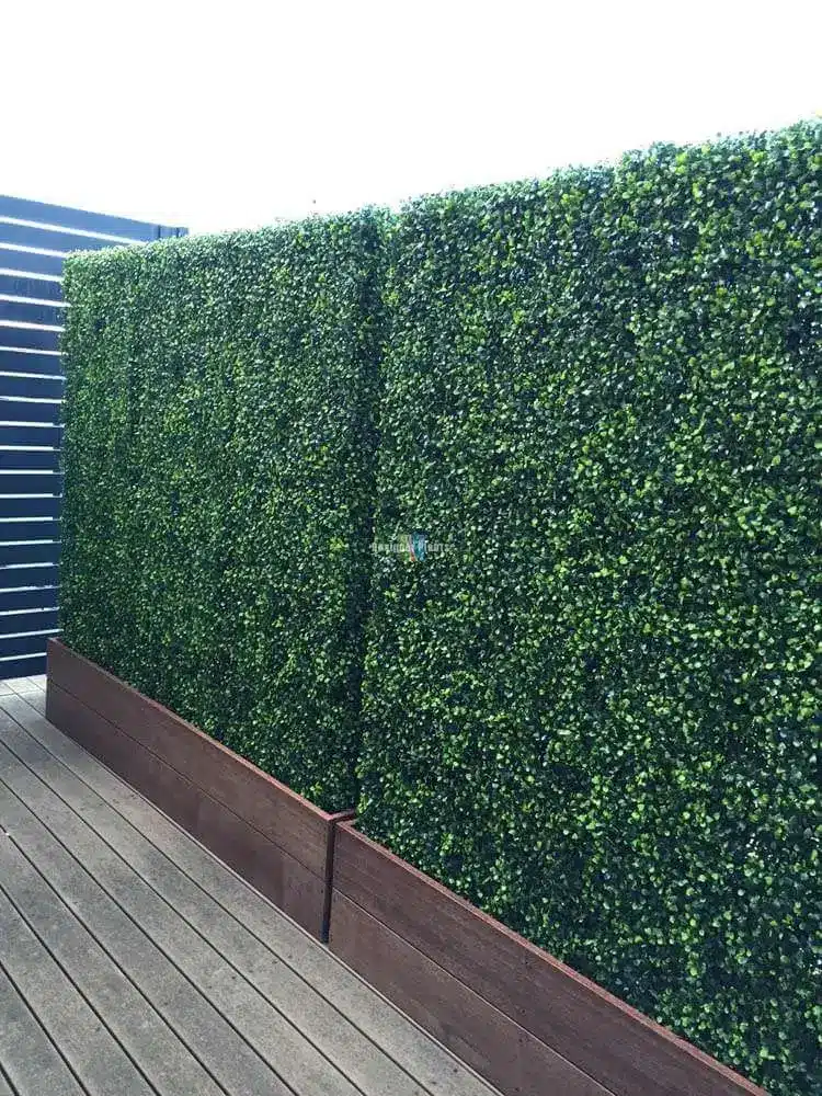 Artificial boxwood hedges with planters