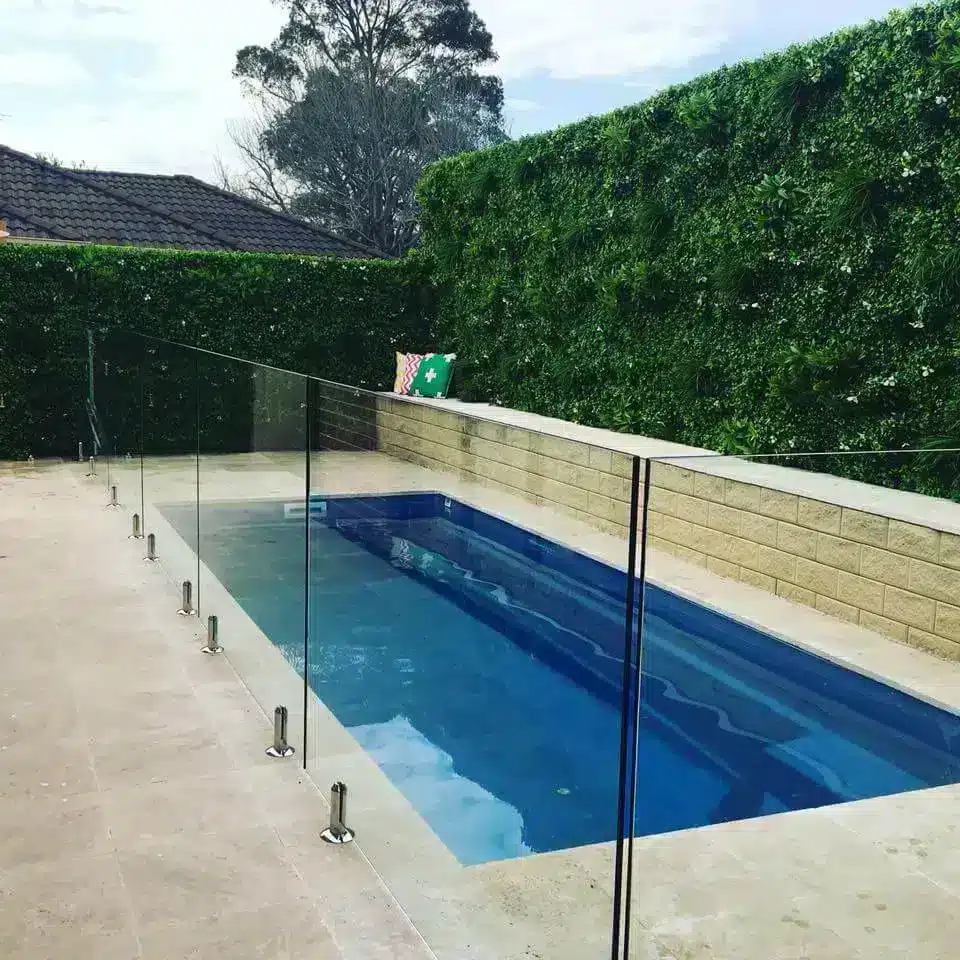 artificial green wall installed near a pool