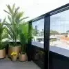 Gold Concrete Planters and Pots with Plants Potted Inside including artificial palm trees