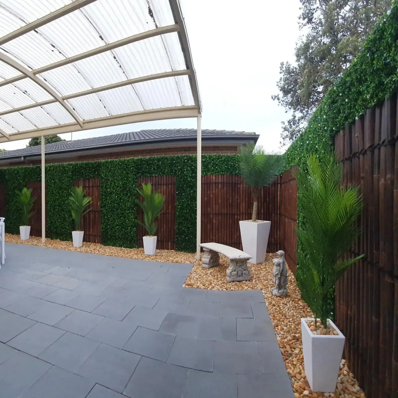 After Installation: Transforming an Outdoor Space with an Artificial Vertical Garden Luxury Flowering Buxus Panels