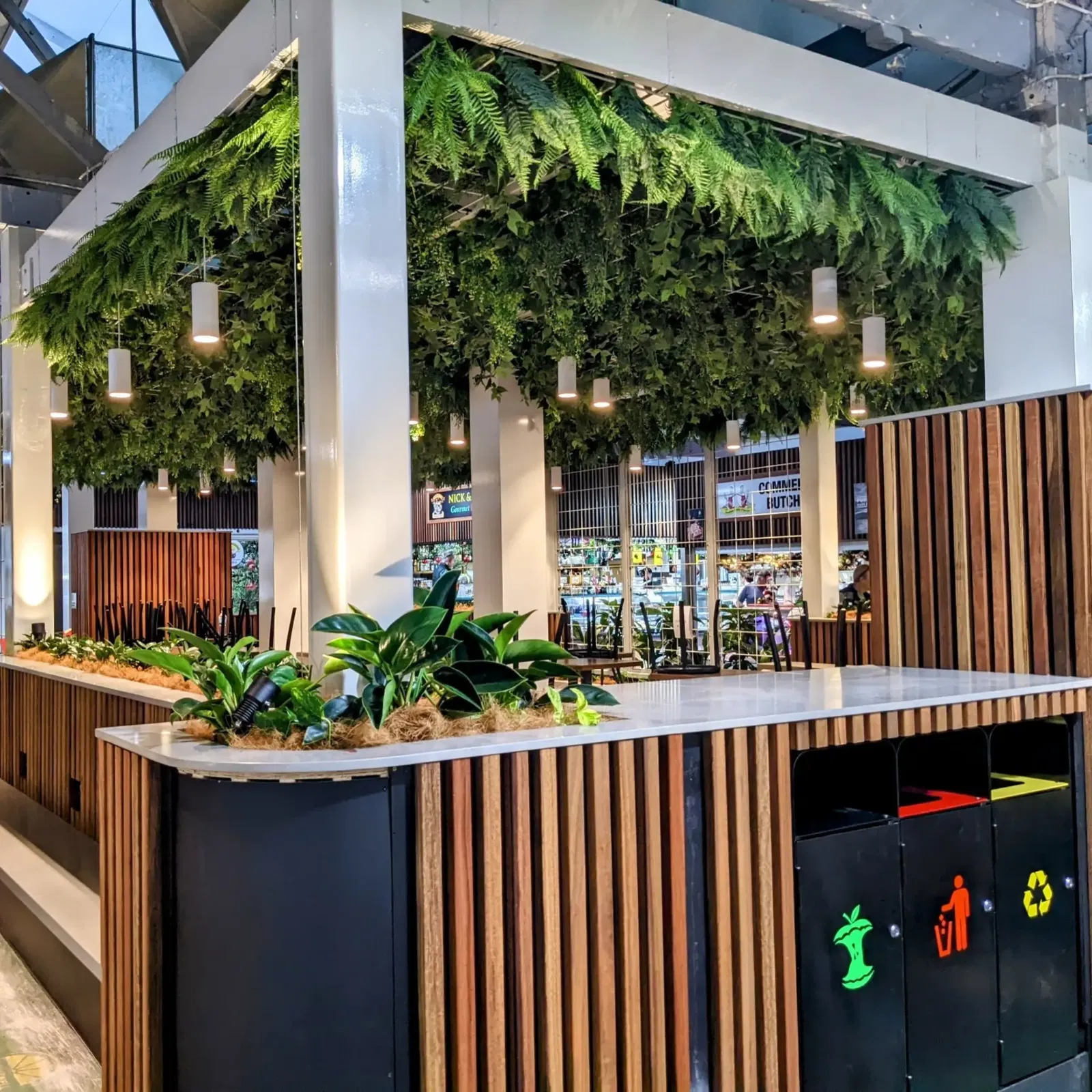 Lush Transformation: Elevating Commercial Spaces with Artificial Hanging Greenery