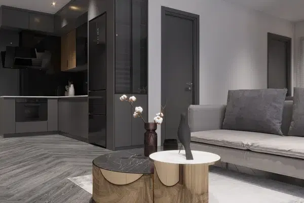 crow sculpture and flower vase on coffee table in living room
