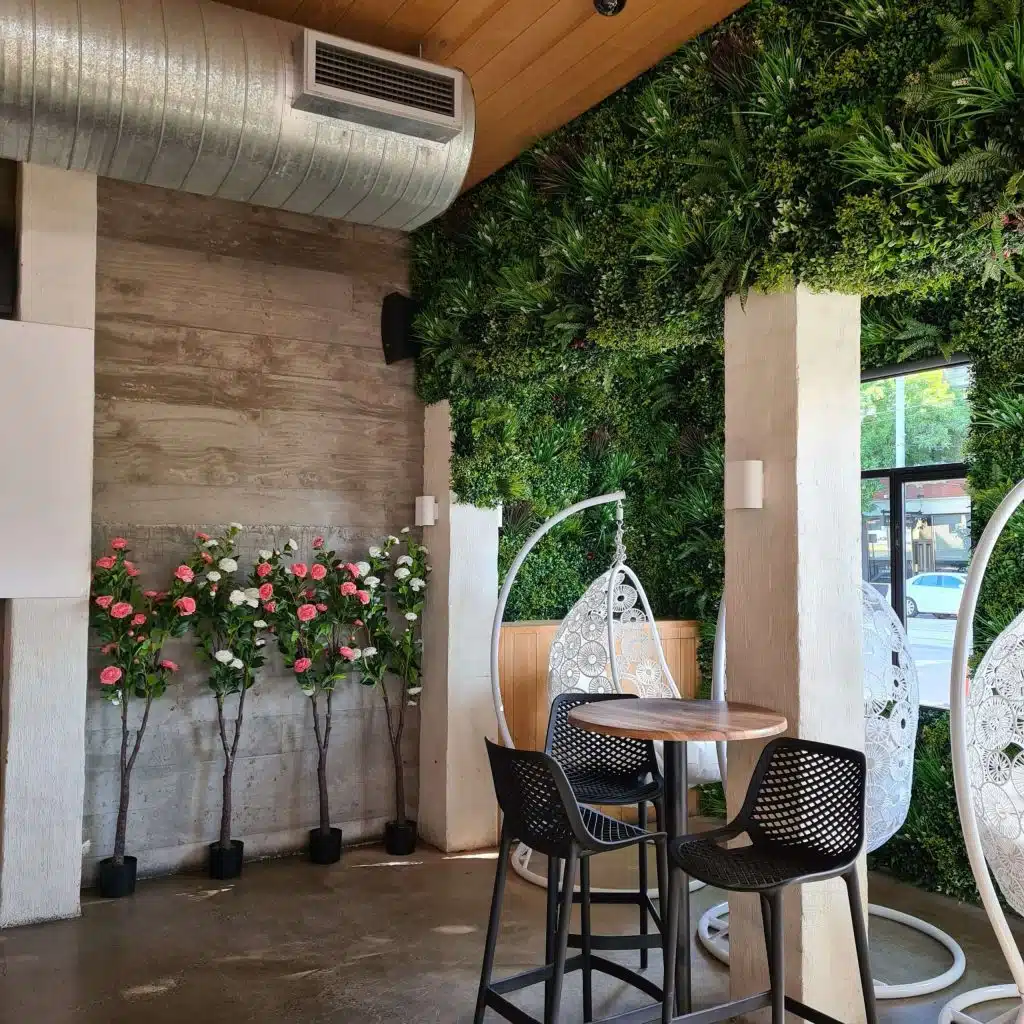Artificial Flowering plants and fake green wall melbounre fitout scaled 1 1024x1024